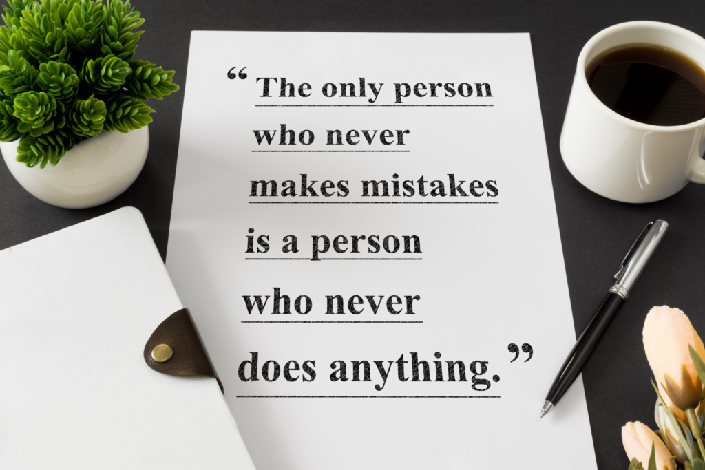 white piece of paper with a quote saying people who don't make mistakes are people who don't do anything