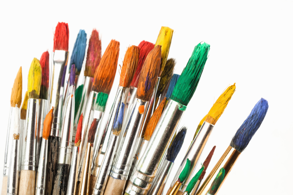 a handful of colorful paint brushes